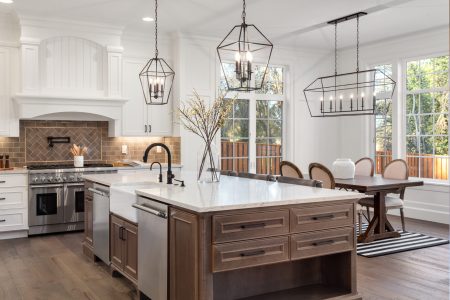 Beautiful kitchen in new traditional style luxury home, with qua Beautiful kitchen in new traditional style luxury home, with quartz counters, hardwood floors, and stainless steel appliances